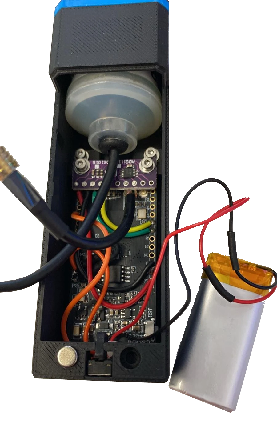 Inside a completed Nitrox Analyser showing the oxygen cell, ADS1115, LilyGo board, wiring, button, battery, and printed housing